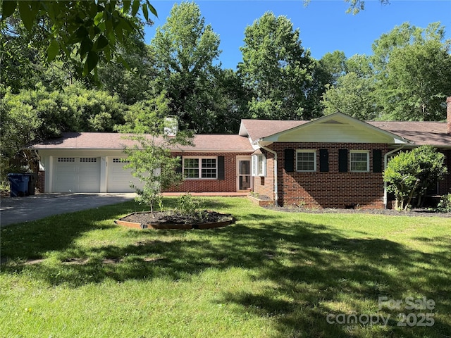 121 33rd Ave NE, Hickory, NC 28601 - single story home with brick siding, an attached garage, a front yard, asphalt driveway, and a chimney