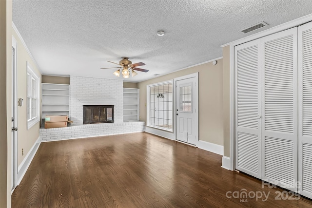 121 33rd Ave NE, Hickory, NC 28601 - unfurnished living room with a ceiling fan, a textured ceiling, ornamental molding, dark wood-style floors, and baseboards