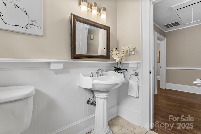 121 33rd Ave NE, Hickory, NC 28601 - bathroom with toilet, wainscoting, and ornamental molding