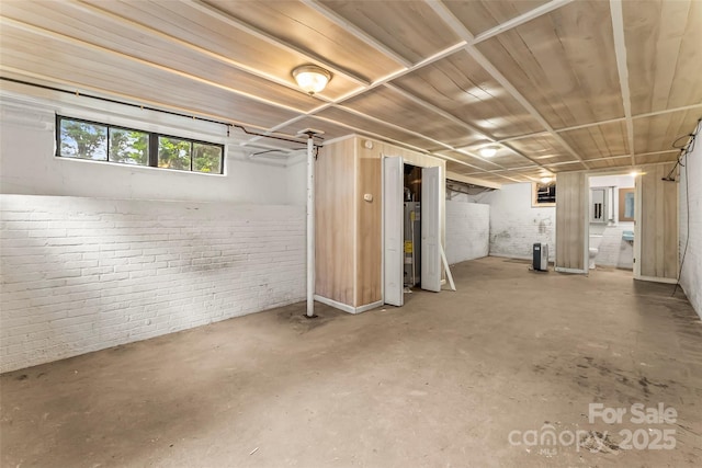 121 33rd Ave NE, Hickory, NC 28601 - basement featuring brick wall and water heater