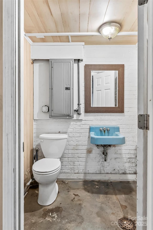 121 33rd Ave NE, Hickory, NC 28601 - half bathroom with unfinished concrete floors, toilet, a sink, and wooden ceiling