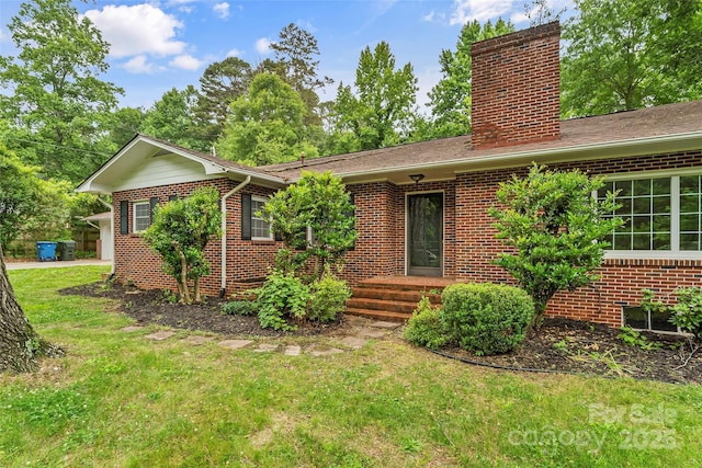 121 33rd Ave NE, Hickory, NC 28601 - ranch-style house featuring a chimney, brick siding, and a front yard