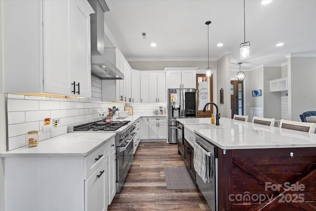 867 Bellegray Rd, Clover, SC 29710 - kitchen with stainless steel appliances, wall chimney range hood, recessed lighting, dark wood-style floors, and ornamental molding