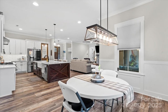 867 Bellegray Rd, Clover, SC 29710 - dining room with wood finished floors, wainscoting, crown molding, and recessed lighting