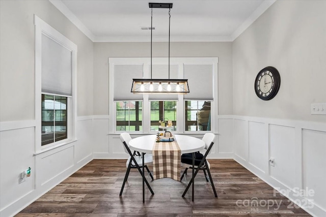 867 Bellegray Rd, Clover, SC 29710 - dining space with dark wood-style flooring, a wainscoted wall, a decorative wall, and crown molding
