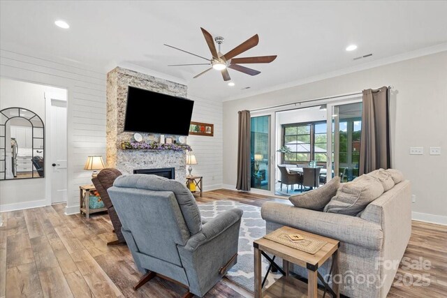 867 Bellegray Rd, Clover, SC 29710 - living area featuring ceiling fan, wood finished floors, ornamental molding, recessed lighting, and a large fireplace