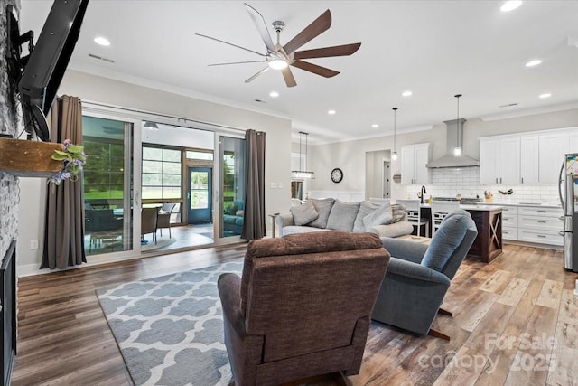 867 Bellegray Rd, Clover, SC 29710 - living room featuring ceiling fan, ornamental molding, light wood-style floors, and recessed lighting