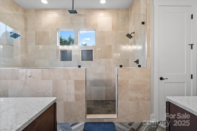 867 Bellegray Rd, Clover, SC 29710 - bathroom featuring vanity, a walk in shower, and tile walls