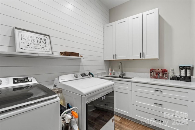 867 Bellegray Rd, Clover, SC 29710 - laundry area with washer and clothes dryer, cabinet space, wood walls, and wood finished floors