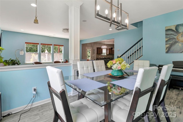 1017 Quail Run Ct, Indian Land, SC 29707 - dining area with decorative columns, wood finished floors, stairway, recessed lighting, and a chandelier