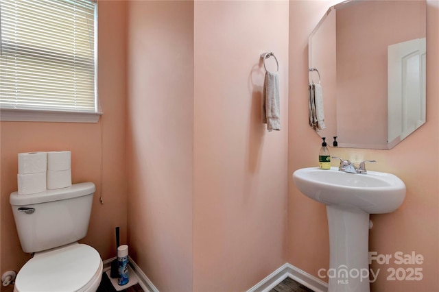 1017 Quail Run Ct, Indian Land, SC 29707 - half bathroom featuring toilet, a sink, and baseboards