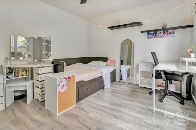 1017 Quail Run Ct, Indian Land, SC 29707 - bedroom featuring light wood finished floors, arched walkways, a desk, vaulted ceiling, and a ceiling fan