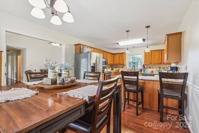 4527 Marshall Ct, Monroe, NC 28110 - dining area featuring a chandelier and wood finished floors