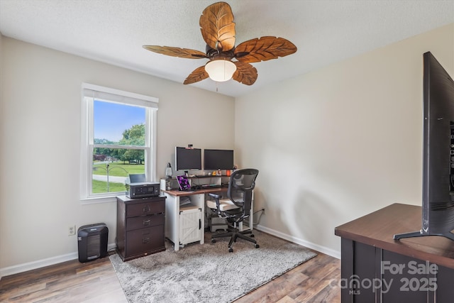 4527 Marshall Ct, Monroe, NC 28110 - home office featuring wood finished floors, a ceiling fan, and baseboards
