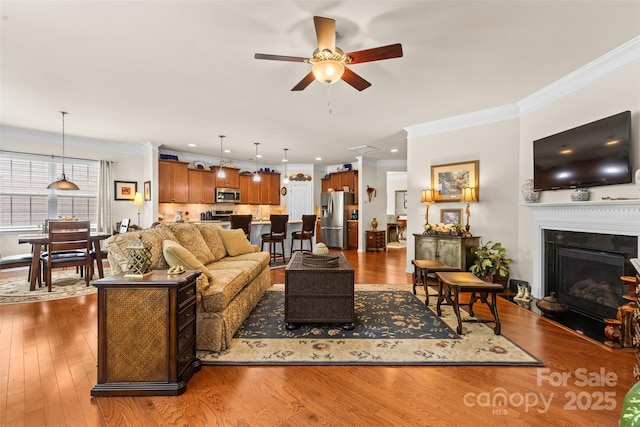 163 Carmen Way, Lancaster, SC 29720 - living room with crown molding, ceiling fan, dark wood finished floors, a fireplace, and recessed lighting