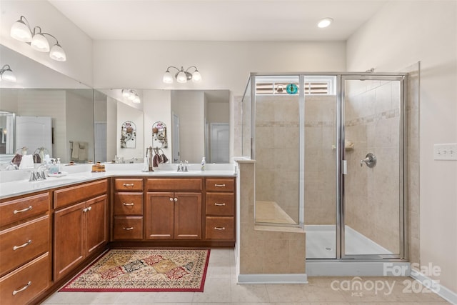 163 Carmen Way, Lancaster, SC 29720 - bathroom with double vanity, tile patterned flooring, a stall shower, and baseboards