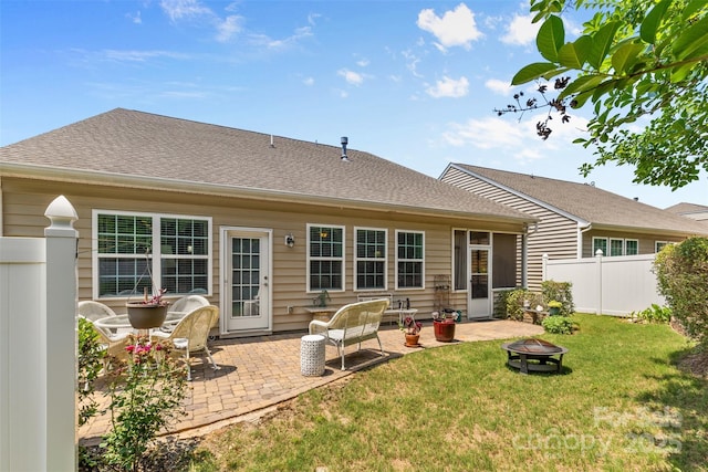 163 Carmen Way, Lancaster, SC 29720 - rear view of property featuring a fire pit, a patio area, and a shingled roof