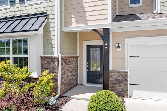14611 Murfield Ct, Charlotte, NC 28278 - entrance to property with a garage, a shingled roof, and stone siding