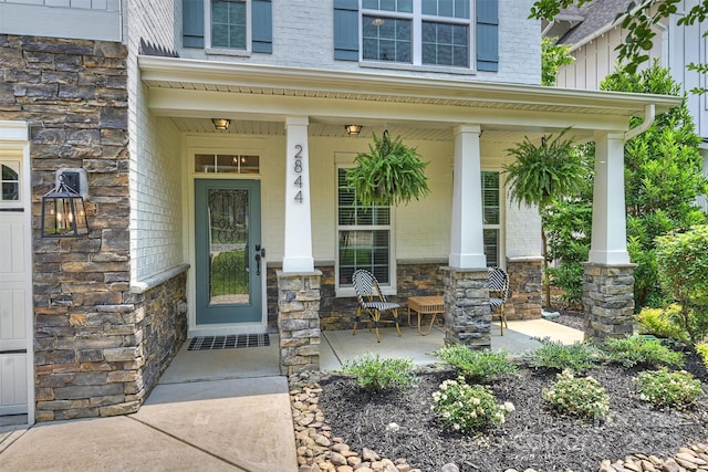 2844 Georgia Ave, Charlotte, NC 28205 - view of exterior entry featuring a porch and stone siding