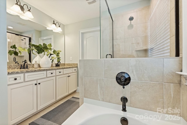2844 Georgia Ave, Charlotte, NC 28205 - full bathroom featuring tiled shower, double vanity, and a tub to relax in