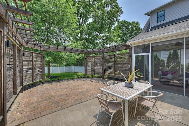2844 Georgia Ave, Charlotte, NC 28205 - fenced backyard featuring a pergola, a patio, outdoor dining space, and a sunroom