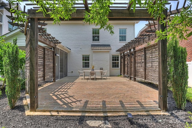 2844 Georgia Ave, Charlotte, NC 28205 - back of house featuring a pergola, brick siding, outdoor dining area, and a patio area