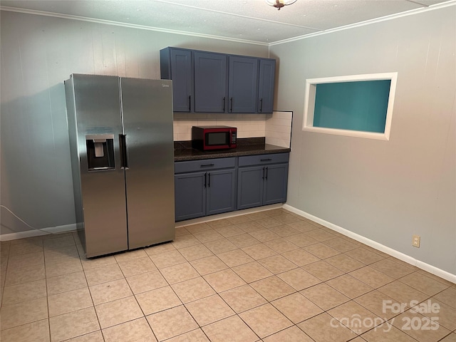 488 John Swofford Rd, Nebo, NC 28761 - kitchen featuring stainless steel refrigerator with ice dispenser, ornamental molding, dark countertops, decorative backsplash, and light tile patterned flooring