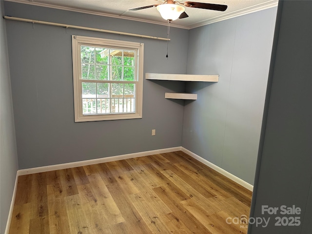 488 John Swofford Rd, Nebo, NC 28761 - spare room with ceiling fan, crown molding, wood finished floors, and baseboards