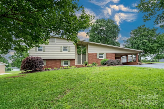 318 Confederate Dr SW, Concord, NC 28027 - view of front of property with brick siding, a front yard, and an attached carport