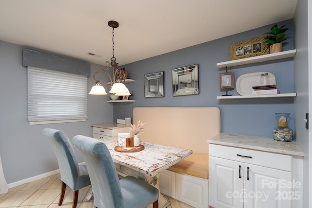 318 Confederate Dr SW, Concord, NC 28027 - dining room featuring baseboards and light tile patterned flooring