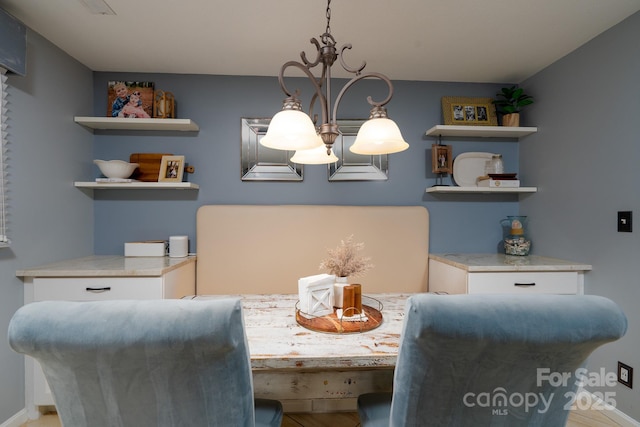 318 Confederate Dr SW, Concord, NC 28027 - dining area with a chandelier and baseboards