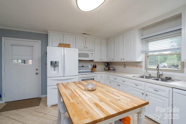 318 Confederate Dr SW, Concord, NC 28027 - kitchen featuring white appliances, a sink, white cabinetry, wooden counters, and crown molding