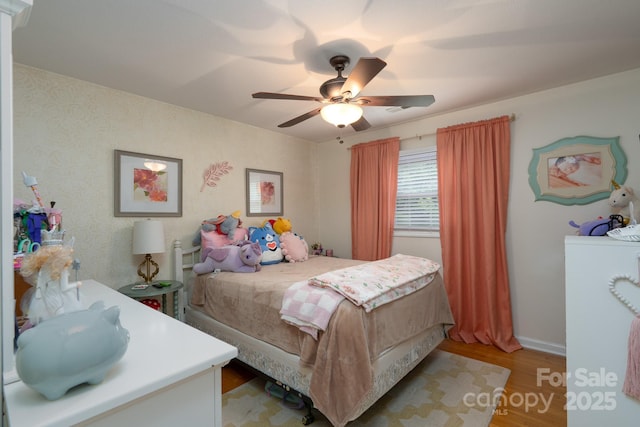 318 Confederate Dr SW, Concord, NC 28027 - bedroom with light wood finished floors, ceiling fan, and baseboards