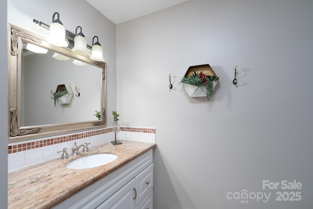 318 Confederate Dr SW, Concord, NC 28027 - bathroom featuring vanity and backsplash
