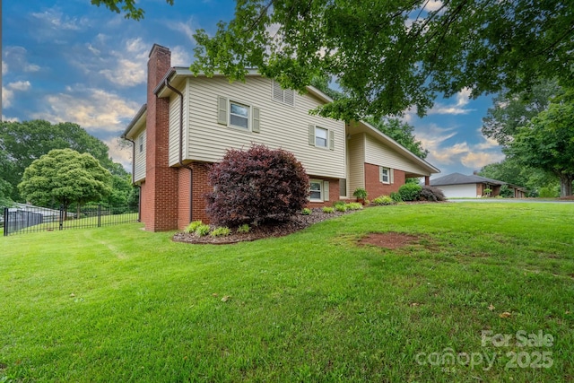 318 Confederate Dr SW, Concord, NC 28027 - view of property exterior featuring a chimney and brick siding