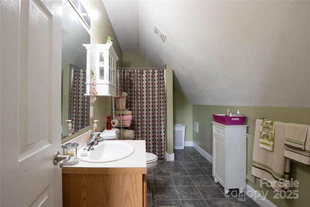 3690 Penland Rd, Spruce Pine, NC 28777 - full bathroom with vaulted ceiling, vanity, toilet, baseboards, and a shower with shower curtain