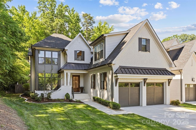 6013 Camile Ct, Charlotte, NC 28226 - view of front of home featuring an attached garage, driveway, a standing seam roof, and a front lawn
