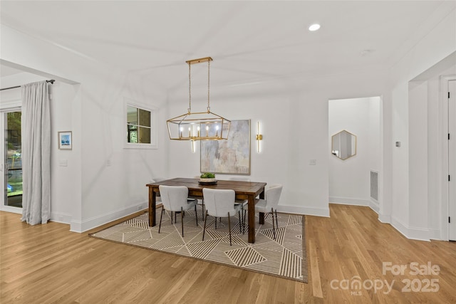 6013 Camile Ct, Charlotte, NC 28226 - dining room featuring baseboards, light wood-style floors, a chandelier, and recessed lighting
