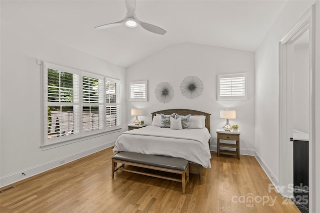 6013 Camile Ct, Charlotte, NC 28226 - bedroom with multiple windows, vaulted ceiling, light wood-style floors, ceiling fan, and baseboards