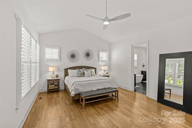 6013 Camile Ct, Charlotte, NC 28226 - bedroom with multiple windows, vaulted ceiling, light wood finished floors, baseboards, and ceiling fan