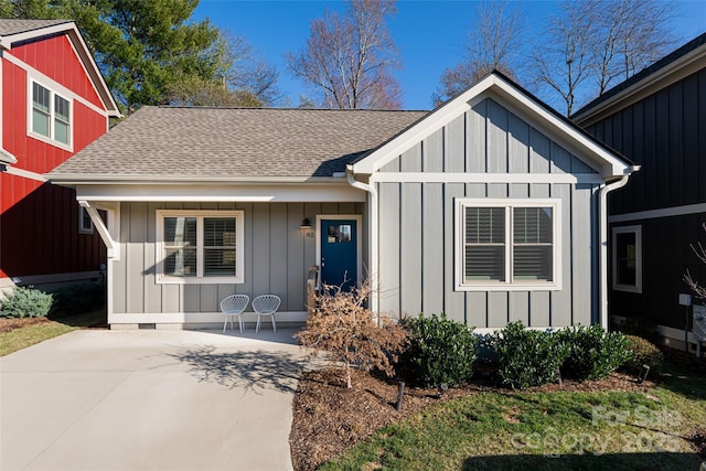 82 Wheeler Rd, Weaverville, NC 28787 - view of front of home with a shingled roof, board and batten siding, and a patio area