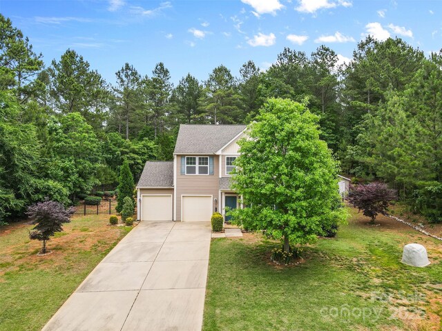 6010 Hawk View Rd, Waxhaw, NC 28173 - view of front of house with driveway, a front yard, a garage, and a shingled roof
