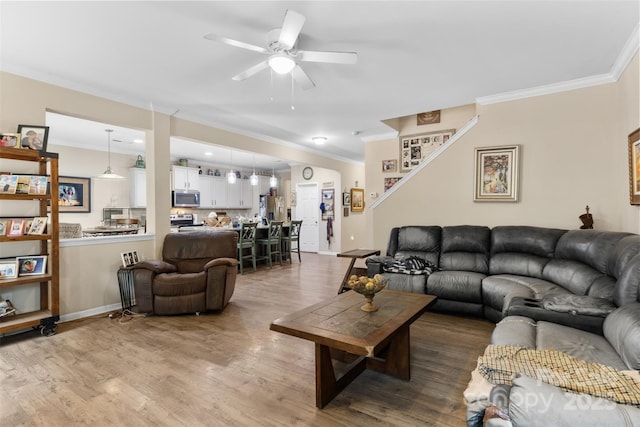 6010 Hawk View Rd, Waxhaw, NC 28173 - living room with crown molding, a ceiling fan, wood finished floors, and baseboards