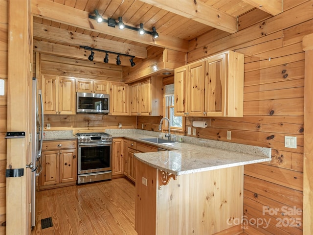 79 Acorn Ln, Rutherfordton, NC 28139 - kitchen with stainless steel appliances, a sink, wooden ceiling with exposed beams, a peninsula, and light wood-type flooring