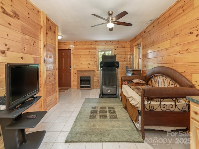 79 Acorn Ln, Rutherfordton, NC 28139 - bedroom with wood walls, light tile patterned floors, and a glass covered fireplace