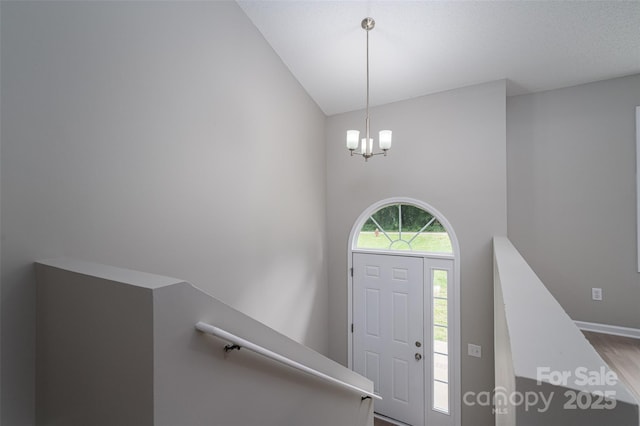 1520 28th St SW, Hickory, NC 28602 - foyer with wood finished floors, high vaulted ceiling, baseboards, and a chandelier