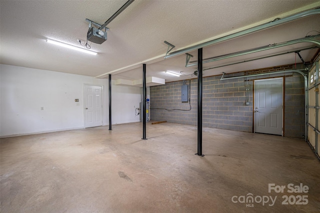 1520 28th St SW, Hickory, NC 28602 - garage with water heater, a garage door opener, electric panel, and concrete block wall