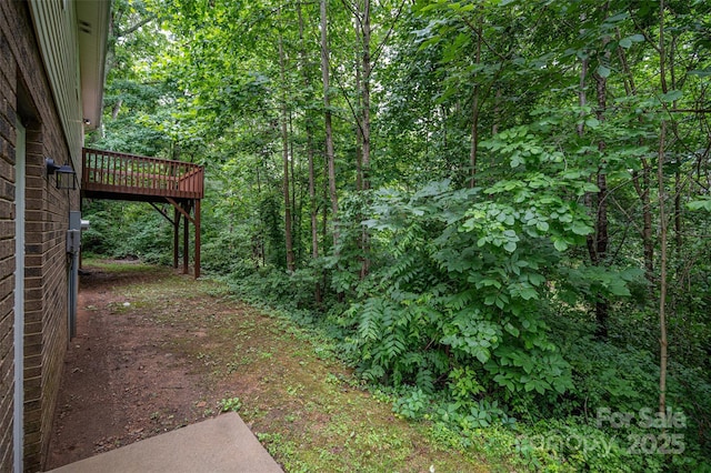 1520 28th St SW, Hickory, NC 28602 - view of yard with a wooded view and a deck