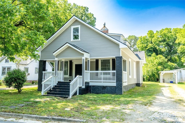 112 Hampton St, Chester, SC 29706 - view of front facade featuring covered porch, a front lawn, and roof with shingles