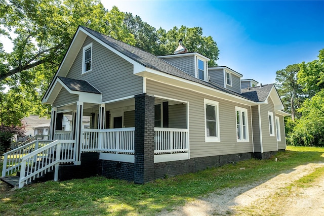 112 Hampton St, Chester, SC 29706 - view of home's exterior featuring crawl space, covered porch, and roof with shingles